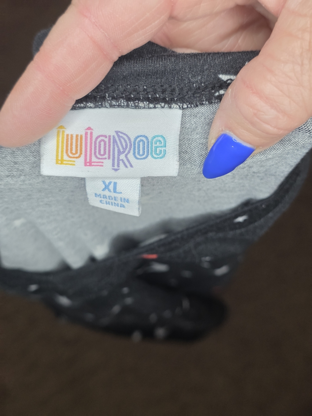 LuLaRoe Black Short Sleeve V-Neck Top with White Stars & Red Crescents - Picture 2 of 2